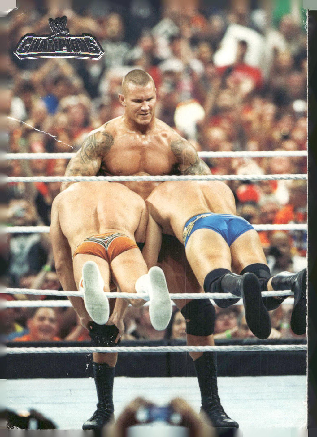 2011 Topps WWE Champions #3 Randy Orton Defeats Rhodes and DiBiase